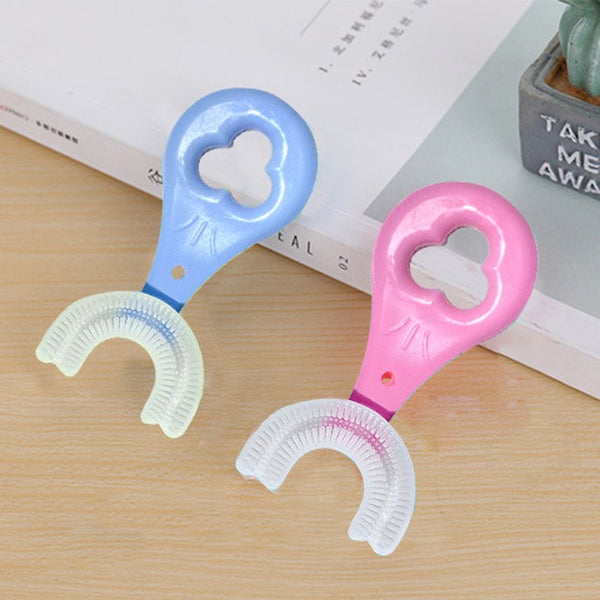 U-shaped toothbrush showing its compact design for children‰۪s dental care.